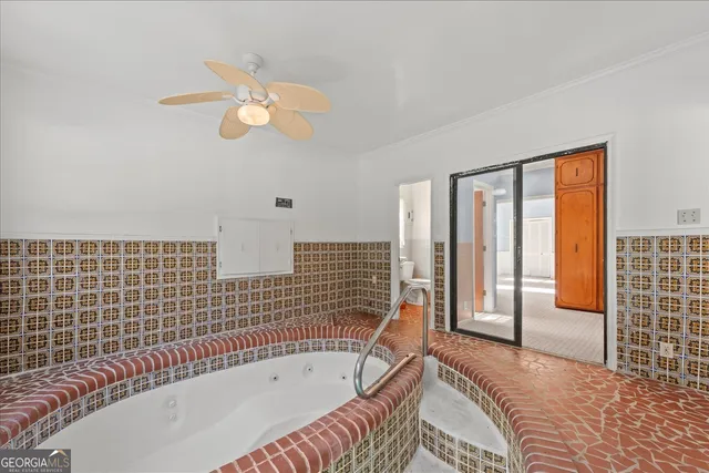 a view of staircase and living room with a fireplace