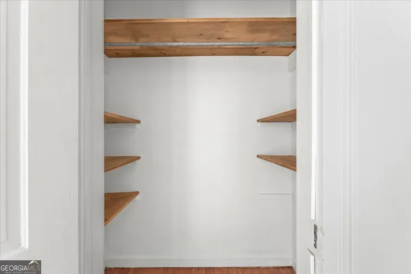 a house that has a tree in front of it