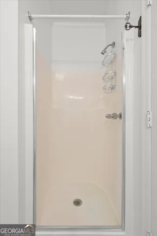 an aerial view of a house with swimming pool and garden space