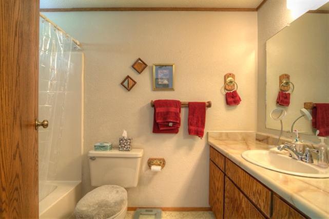 7192 Lower River Road Grants Pass, OR 97526 - Photo 8 of 30 a bathroom with a sink a toilet and shower