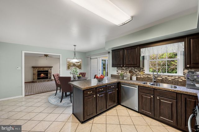 a kitchen with a sink and stove
