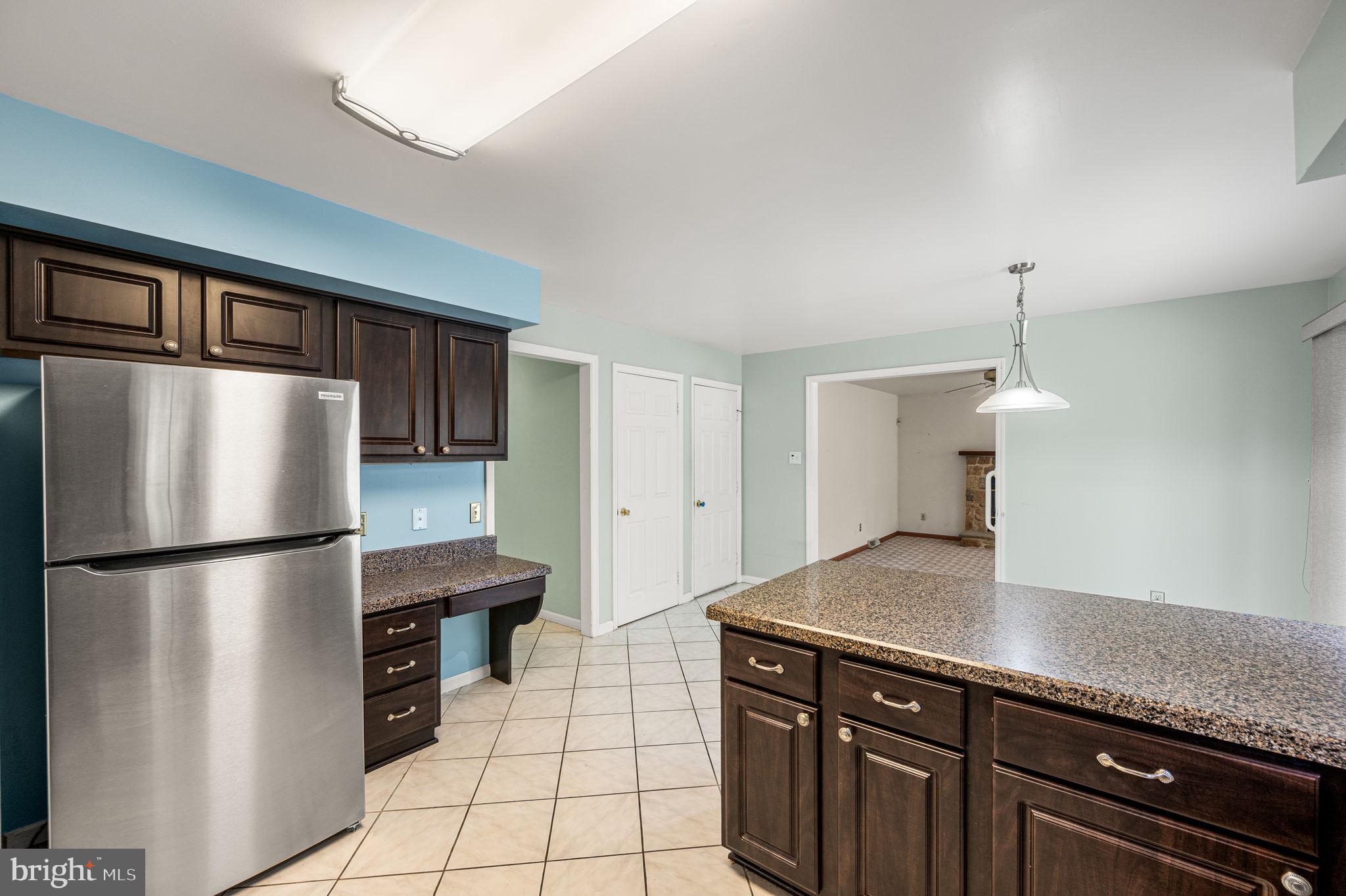 23 East Knowlton Road Media, PA 19063 - Photo 15 of 40 a kitchen with stainless steel appliances granite countertop a refrigerator a sink and white cabinets