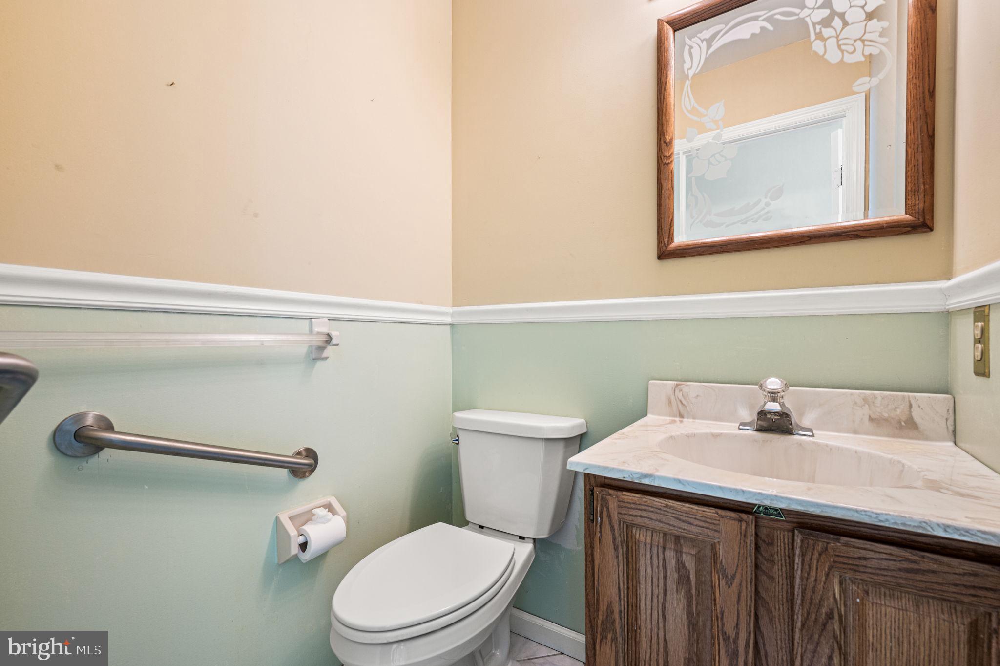 23 East Knowlton Road Media, PA 19063 - Photo 21 of 40 a bathroom with a sink a toilet and a mirror