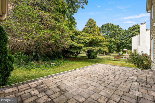 a view of a garden with a building