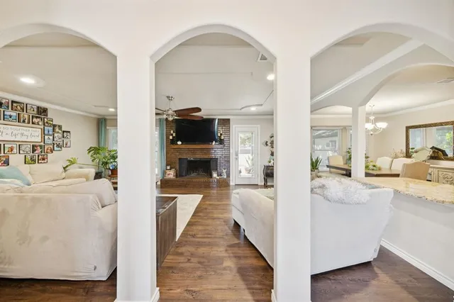 a view of living room with furniture and a wooden floor