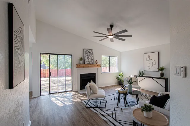 a living room with furniture and a fireplace