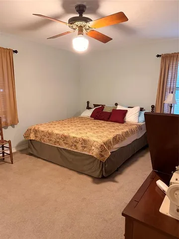 a bathroom with a sink toilet vanity and granite