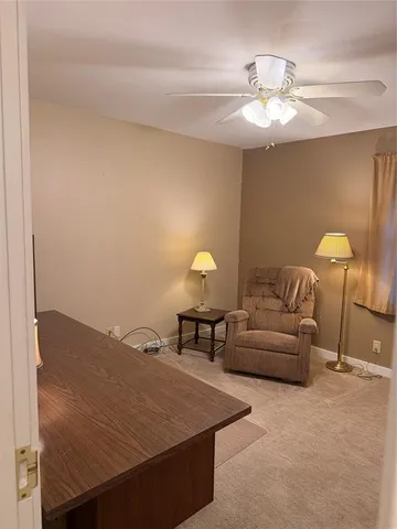 a white toilet and tub sitting next to a bathroom sink