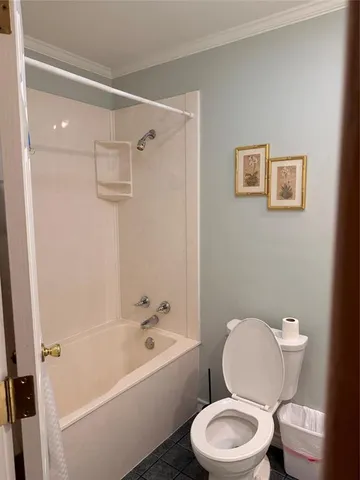 a bed sitting in a room next to a window