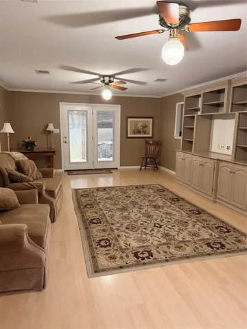 a living room with furniture rug and window