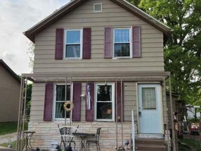 607 East 6th Street Delavan, IL 61734 - Photo 1 of 1 a view of brick house with large windows