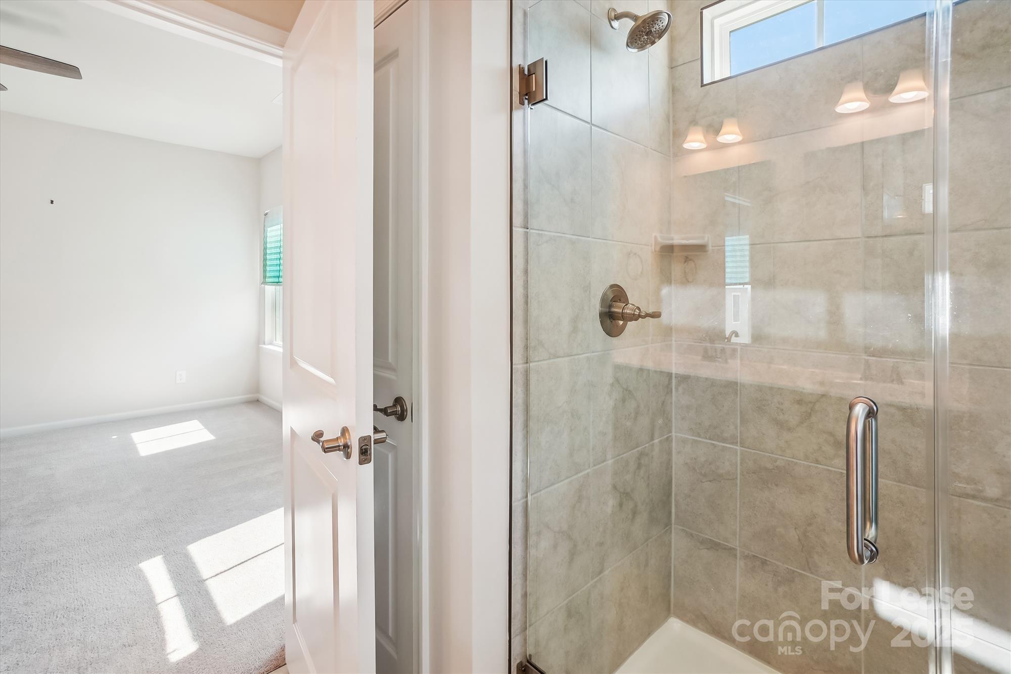 918 Portrush Lane Tega Cay, SC 29708 - Photo 27 of 36 a bathroom with a shower
