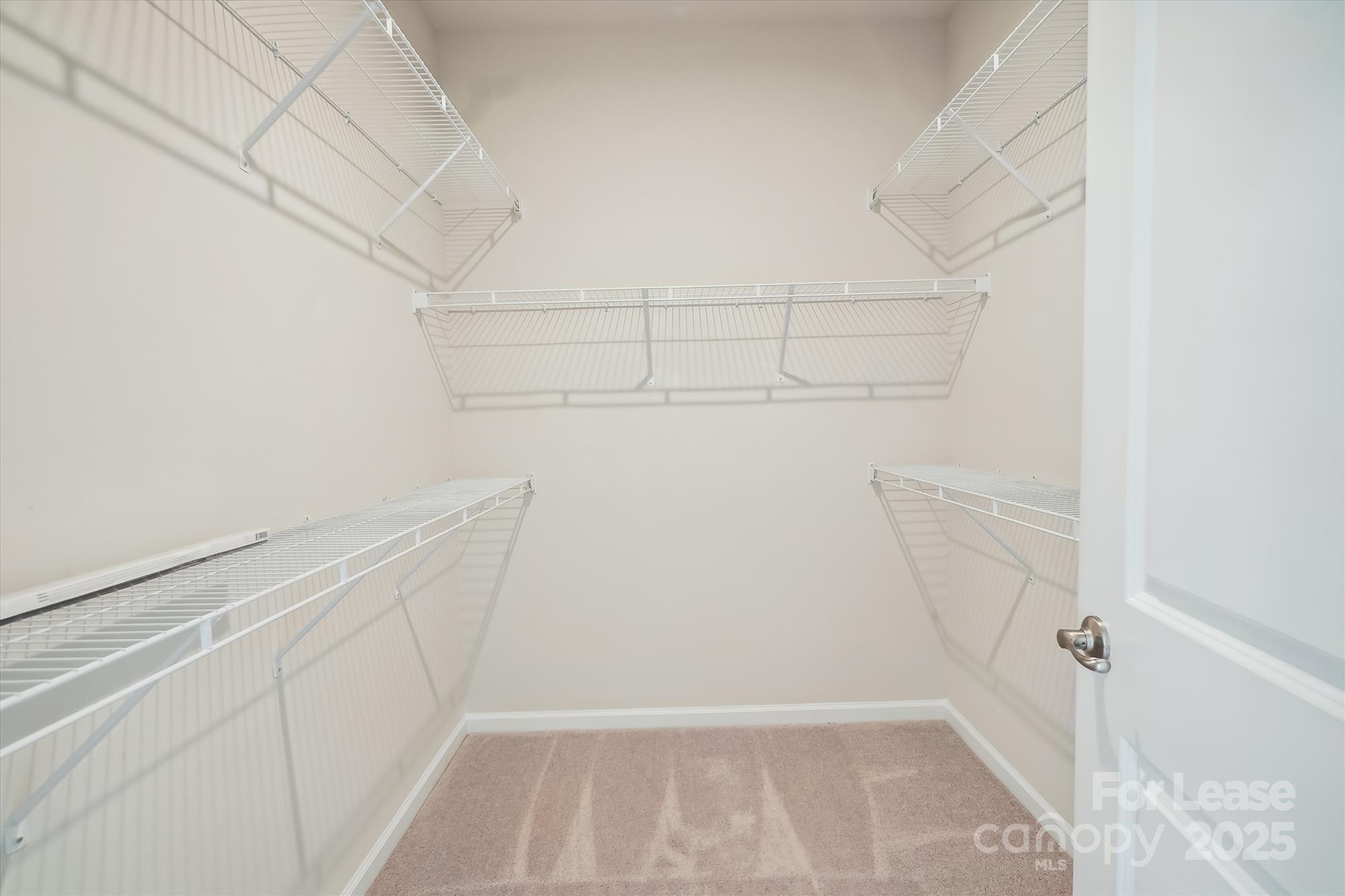 918 Portrush Lane Tega Cay, SC 29708 - Photo 31 of 36 a view of walk in closet with empty racks