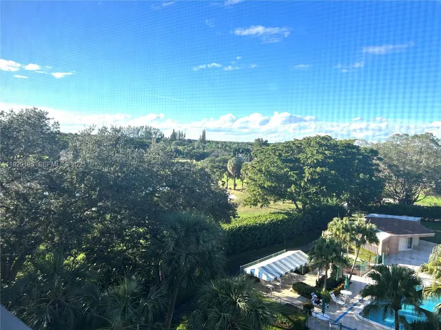 a view of a lake with a yard