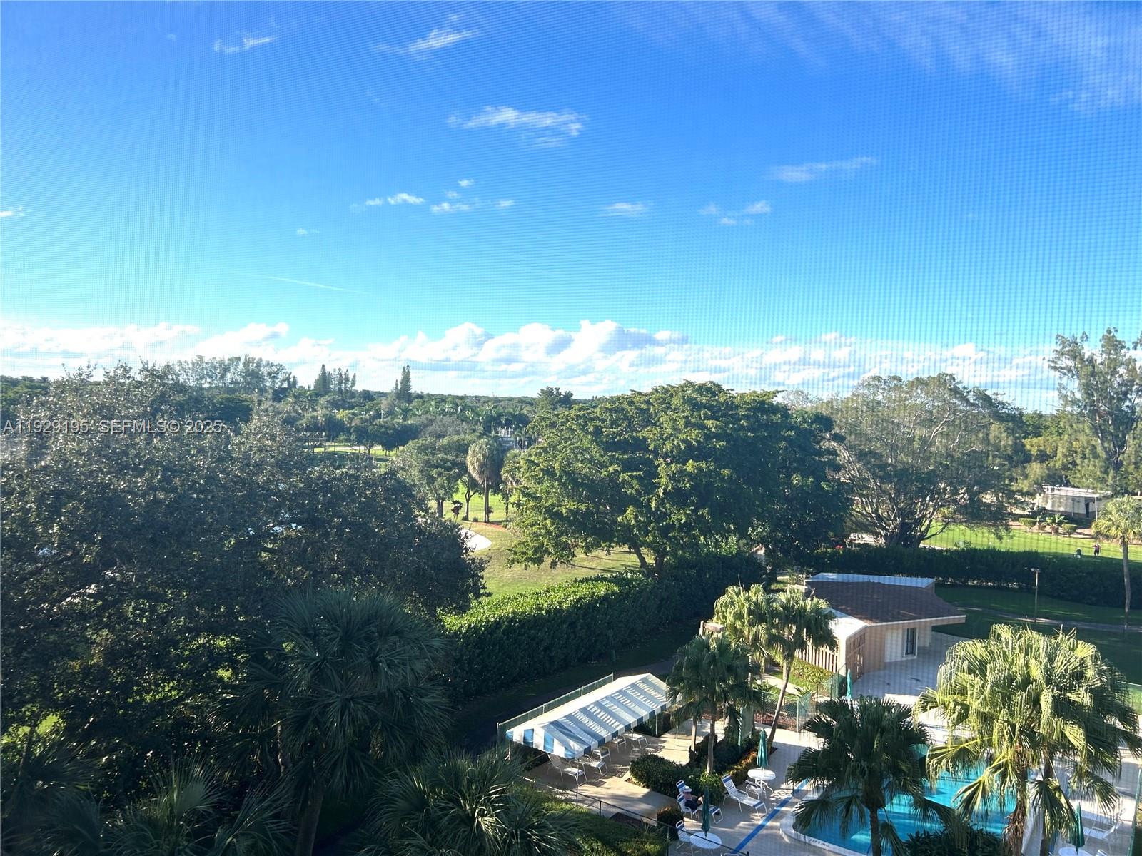 900 St Charles Place, Unit 606 Pembroke Pines, FL 33026 - Photo 18 of 36 a view of a lake with a city