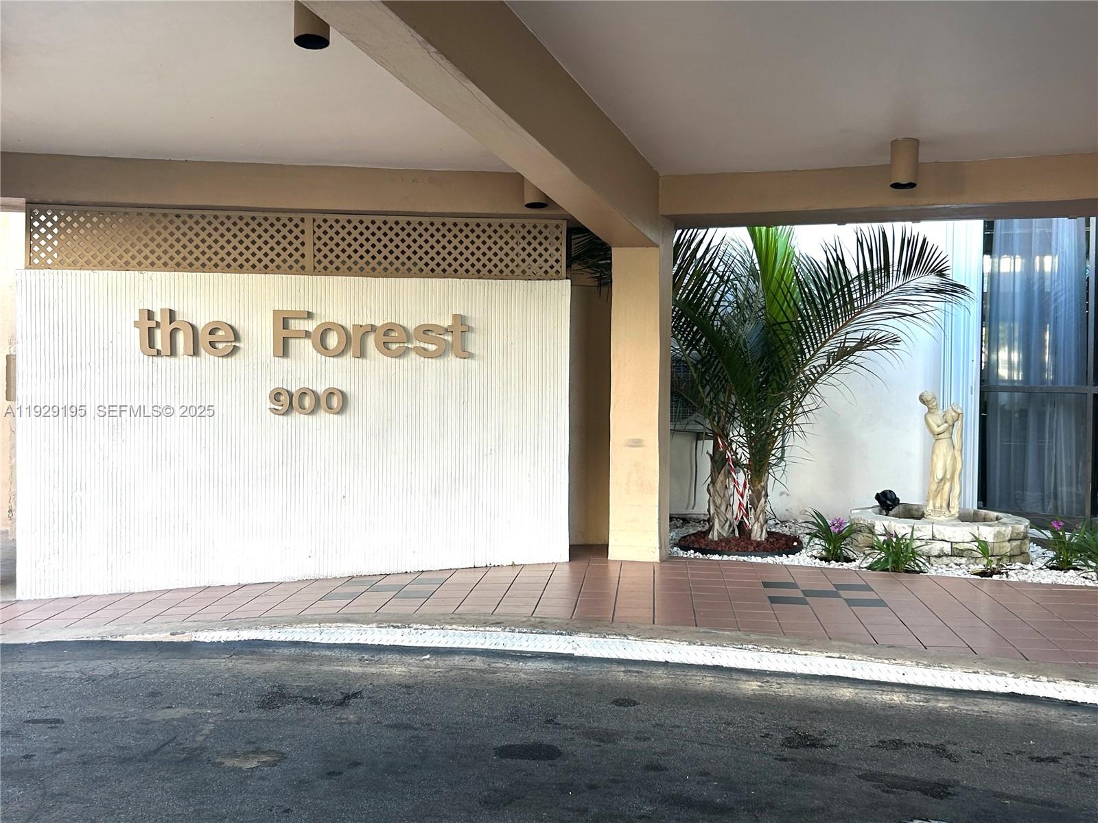 900 St Charles Place, Unit 606 Pembroke Pines, FL 33026 - Photo 26 of 36 a view of a floor to ceiling window and a tree