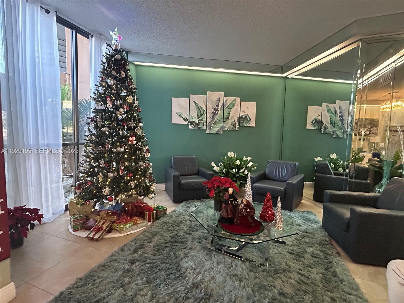 900 St Charles Place, Unit 606 Pembroke Pines, FL 33026 - Photo 27 of 36 a room with lots of flower plants and glass door