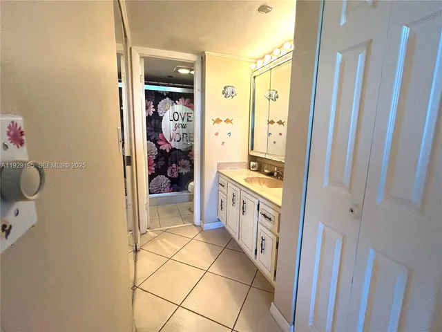 a bathroom with a sink and mirror