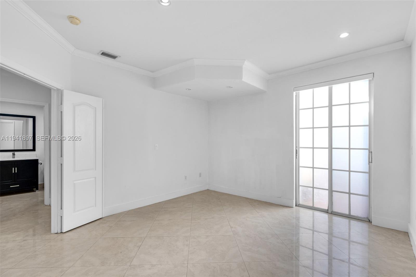 5505 Northwest 112th Path, Unit 5505 Doral, FL 33178 - Photo 17 of 44 a view of an empty room with a window