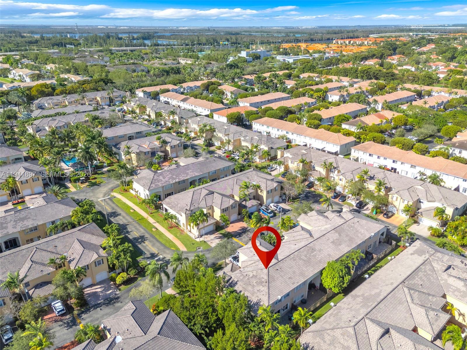 5505 Northwest 112th Path, Unit 5505 Doral, FL 33178 - Photo 38 of 44 an aerial view of residential houses with outdoor space