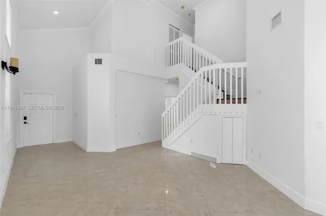 a view of an entryway with staircase