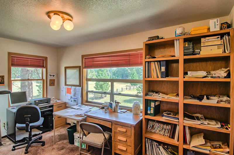9375 Thatcher Mill Road Shingletown, CA 96088 - Photo 11 of 23 a view of a workspace with furniture and a window