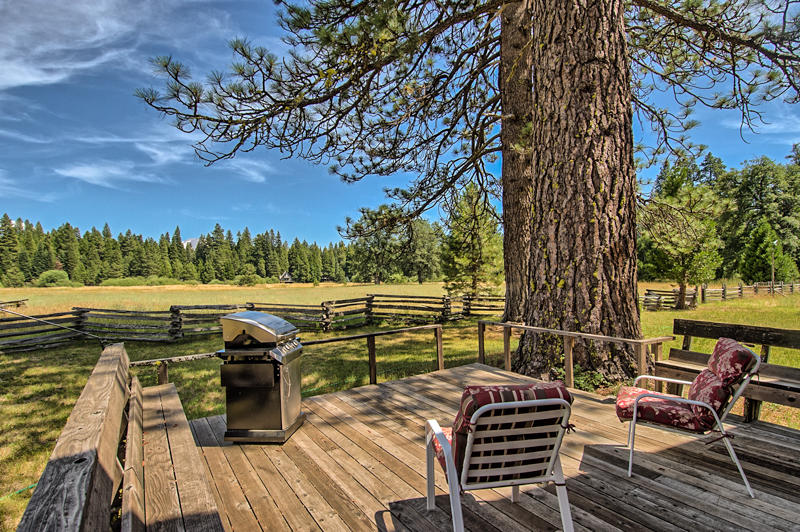 9375 Thatcher Mill Road Shingletown, CA 96088 - Photo 13 of 23 a view of a roof deck with couches and wooden fence