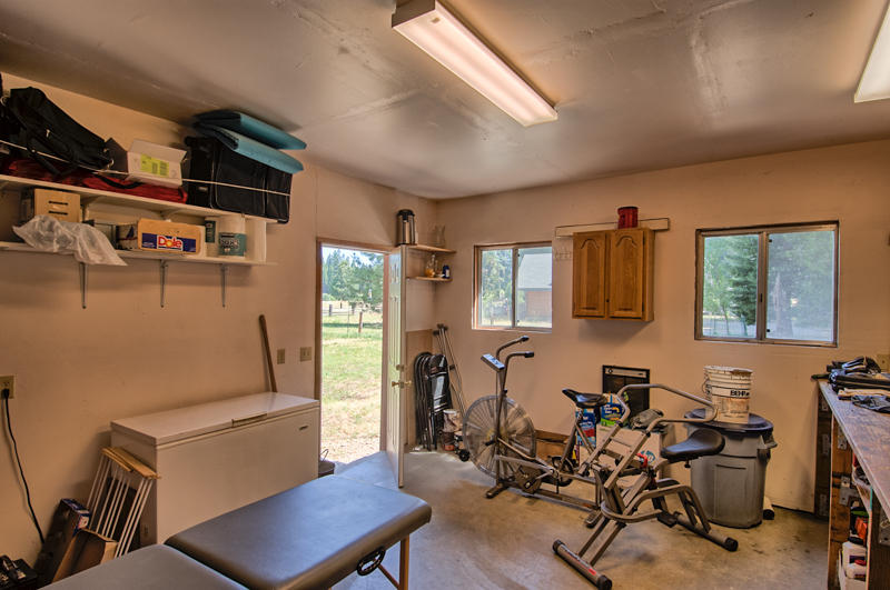 9375 Thatcher Mill Road Shingletown, CA 96088 - Photo 20 of 23 a room with furniture a rug and a window