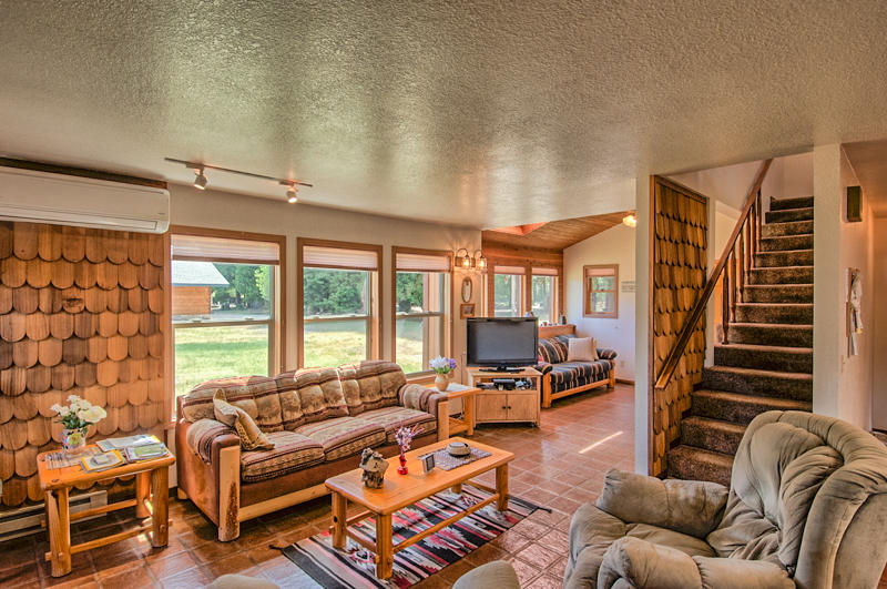 9375 Thatcher Mill Road Shingletown, CA 96088 - Photo 3 of 23 a living room with furniture and a large window