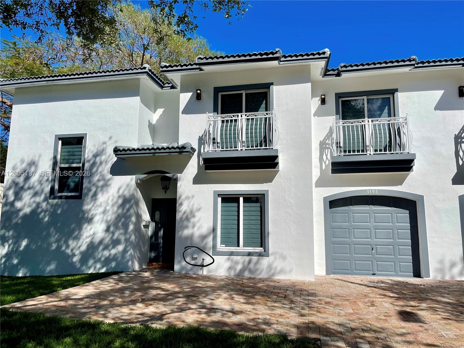 3191 Ohio Street Miami, FL 33133 - Photo 1 of 32 a front view of a house with garage