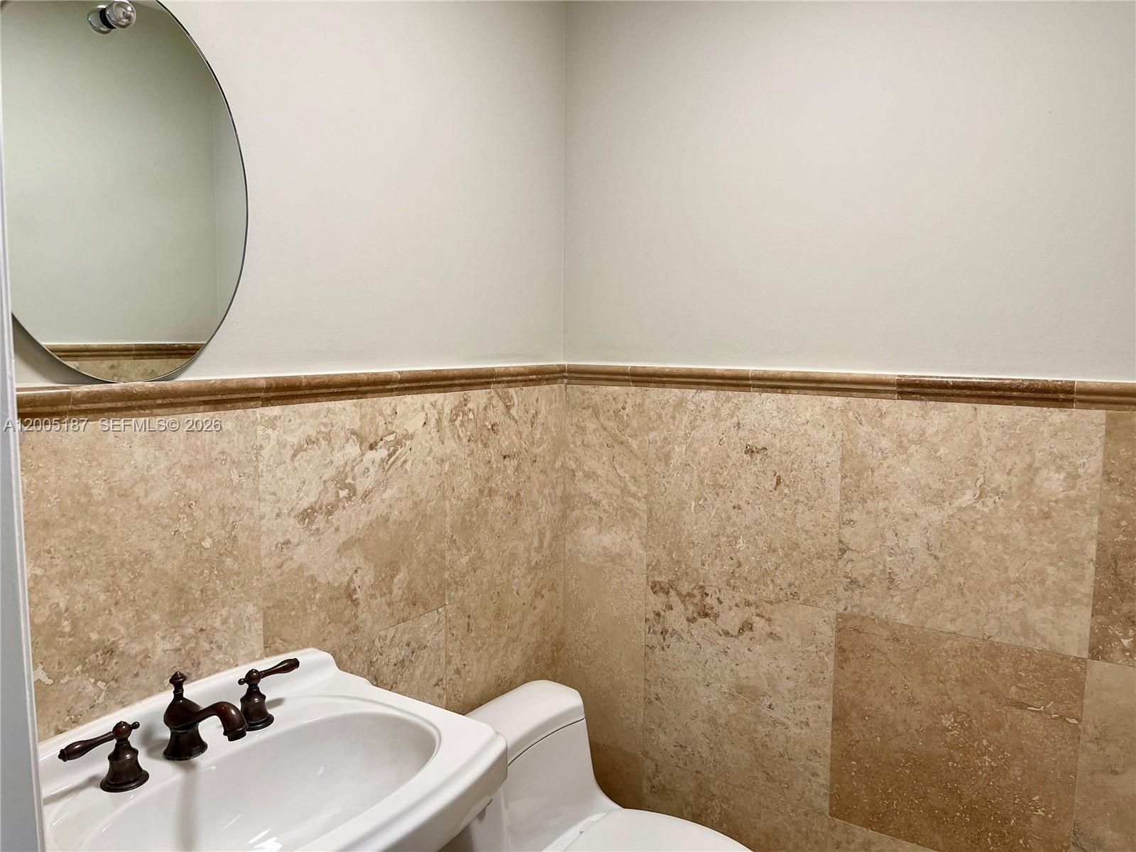 3191 Ohio Street Miami, FL 33133 - Photo 11 of 32 a bathroom with a sink and a mirror