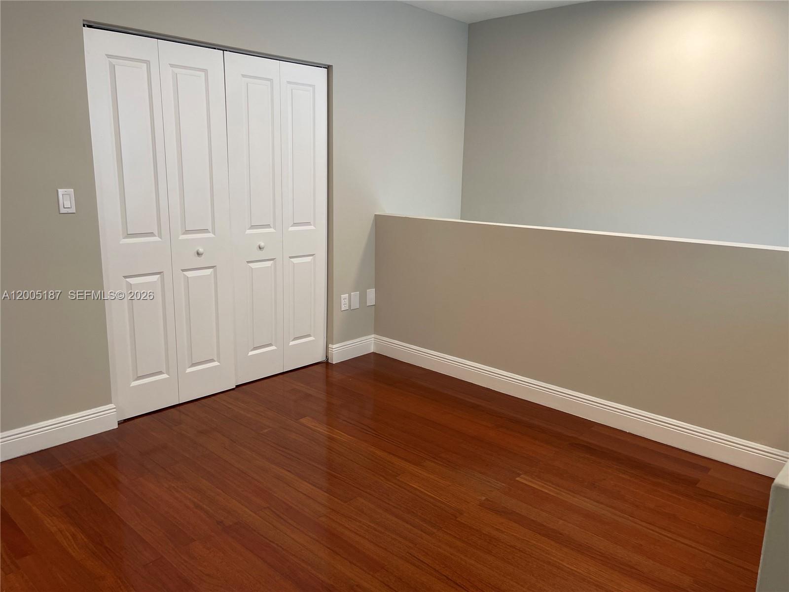 3191 Ohio Street Miami, FL 33133 - Photo 13 of 32 a view of an empty room with wooden floor