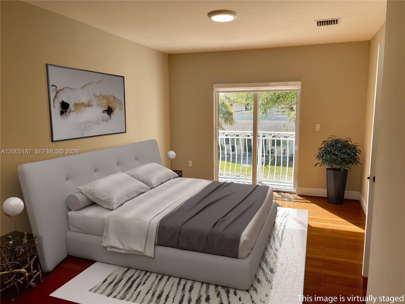 3191 Ohio Street Miami, FL 33133 - Photo 17 of 32 a bedroom with a bed and a large window