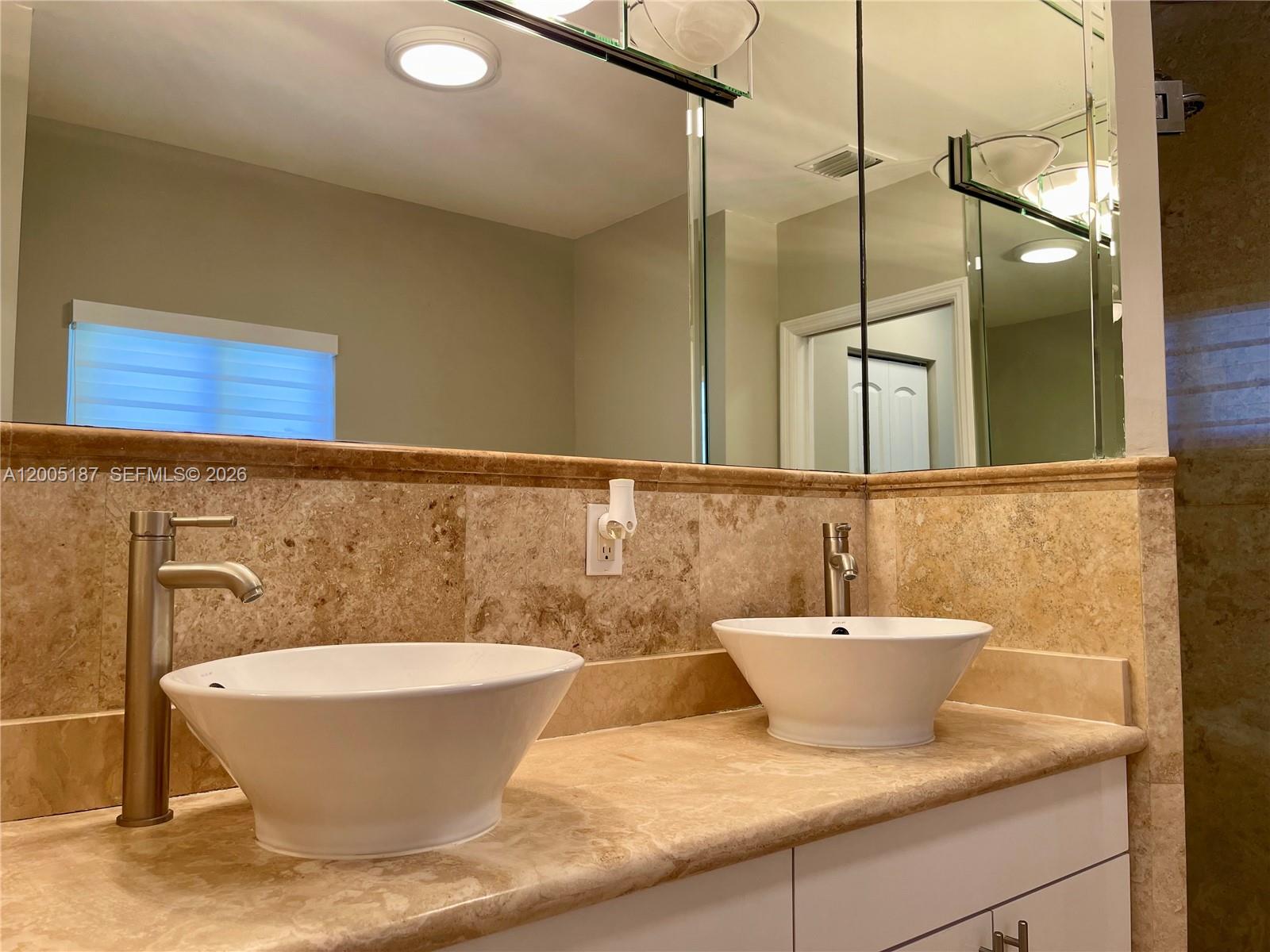 3191 Ohio Street Miami, FL 33133 - Photo 20 of 32 a bathroom with a bathtub and a sink