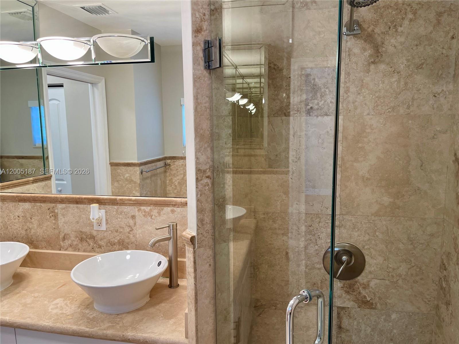 3191 Ohio Street Miami, FL 33133 - Photo 22 of 32 a bathroom with a toilet a sink and mirror