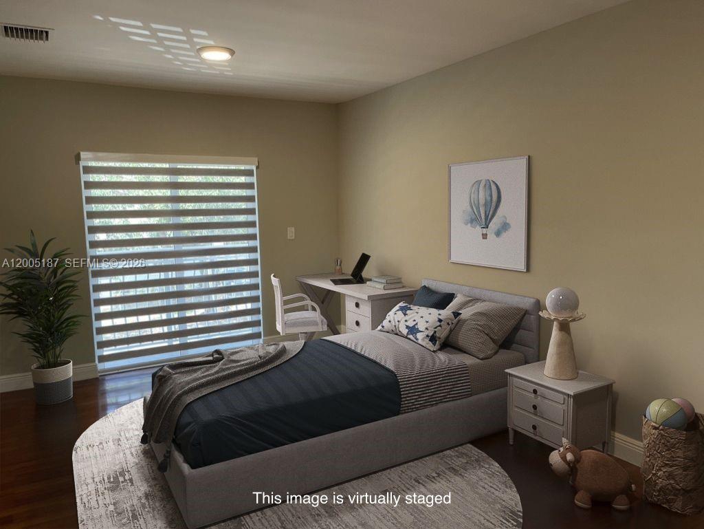 3191 Ohio Street Miami, FL 33133 - Photo 23 of 32 a bedroom with a bed and a window