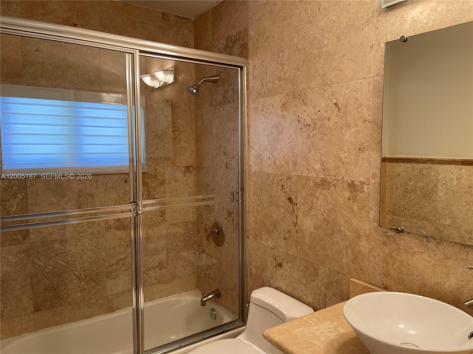 3191 Ohio Street Miami, FL 33133 - Photo 25 of 32 a bathroom with a toilet and a shower