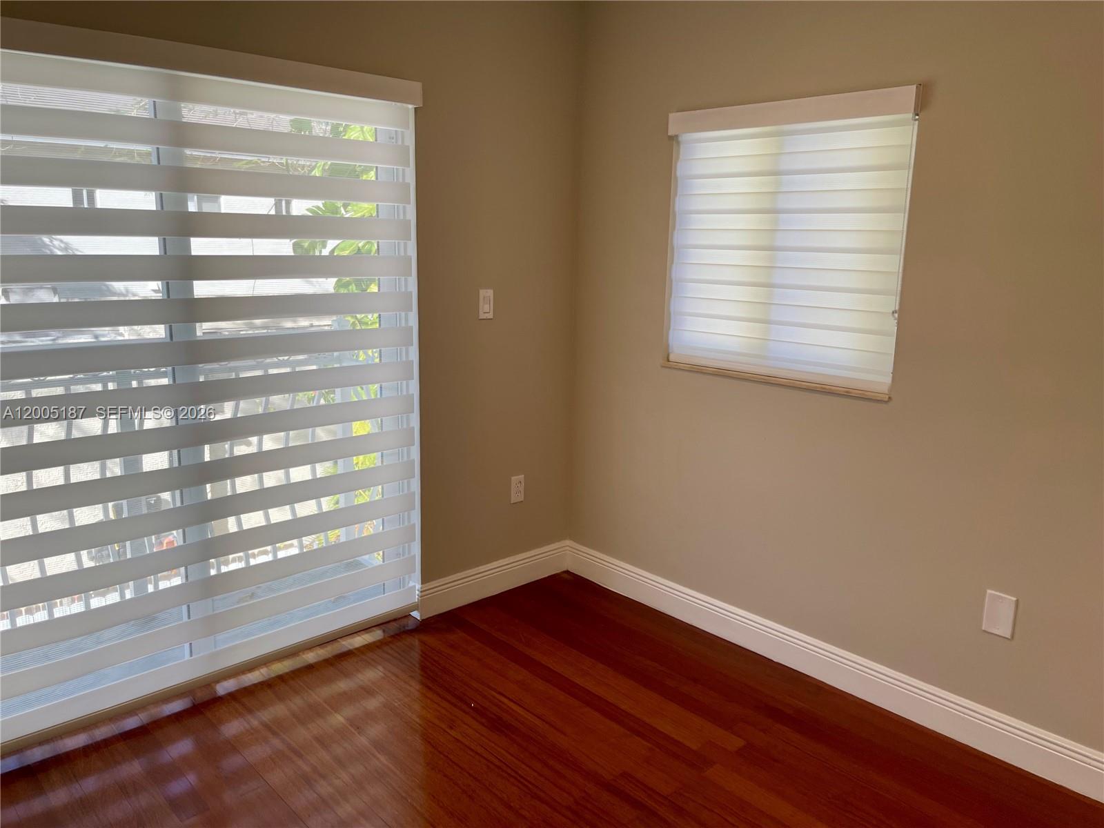 3191 Ohio Street Miami, FL 33133 - Photo 26 of 32 a view of empty room with wooden floor and fan