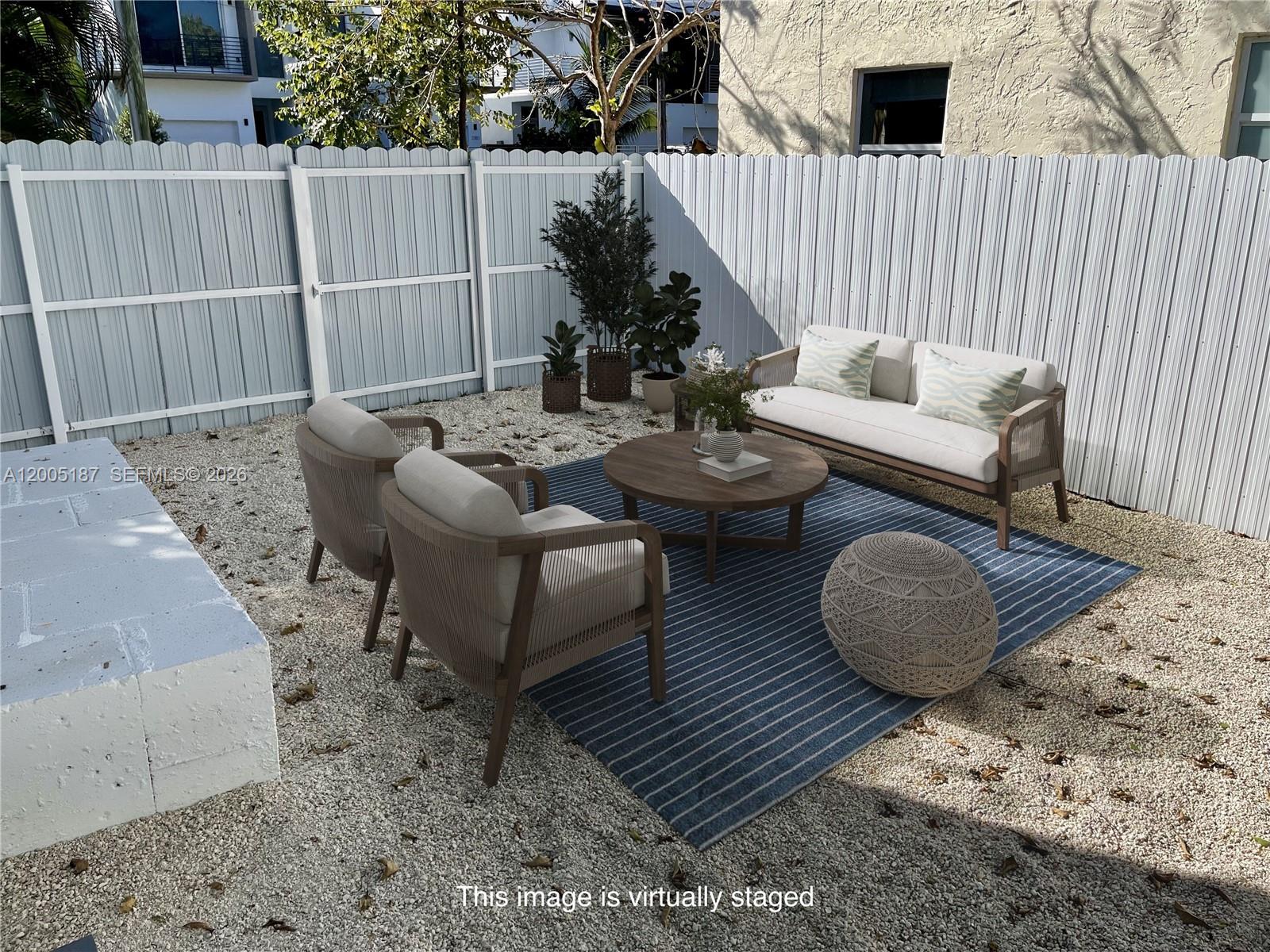 3191 Ohio Street Miami, FL 33133 - Photo 30 of 32 a view of a patio with couple of chairs