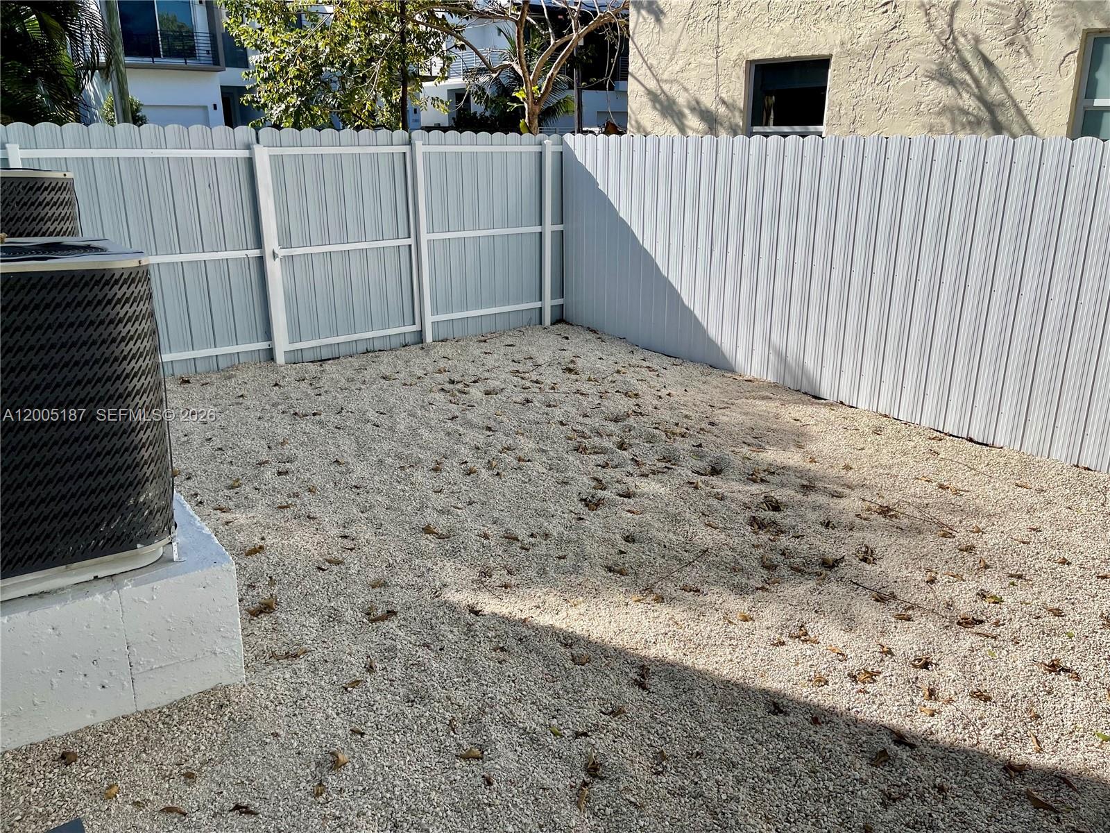 3191 Ohio Street Miami, FL 33133 - Photo 31 of 32 a view of outdoor space with wooden fence
