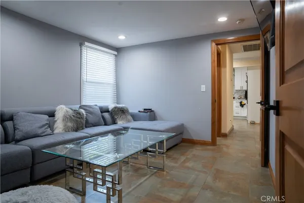 a living room with furniture and a window