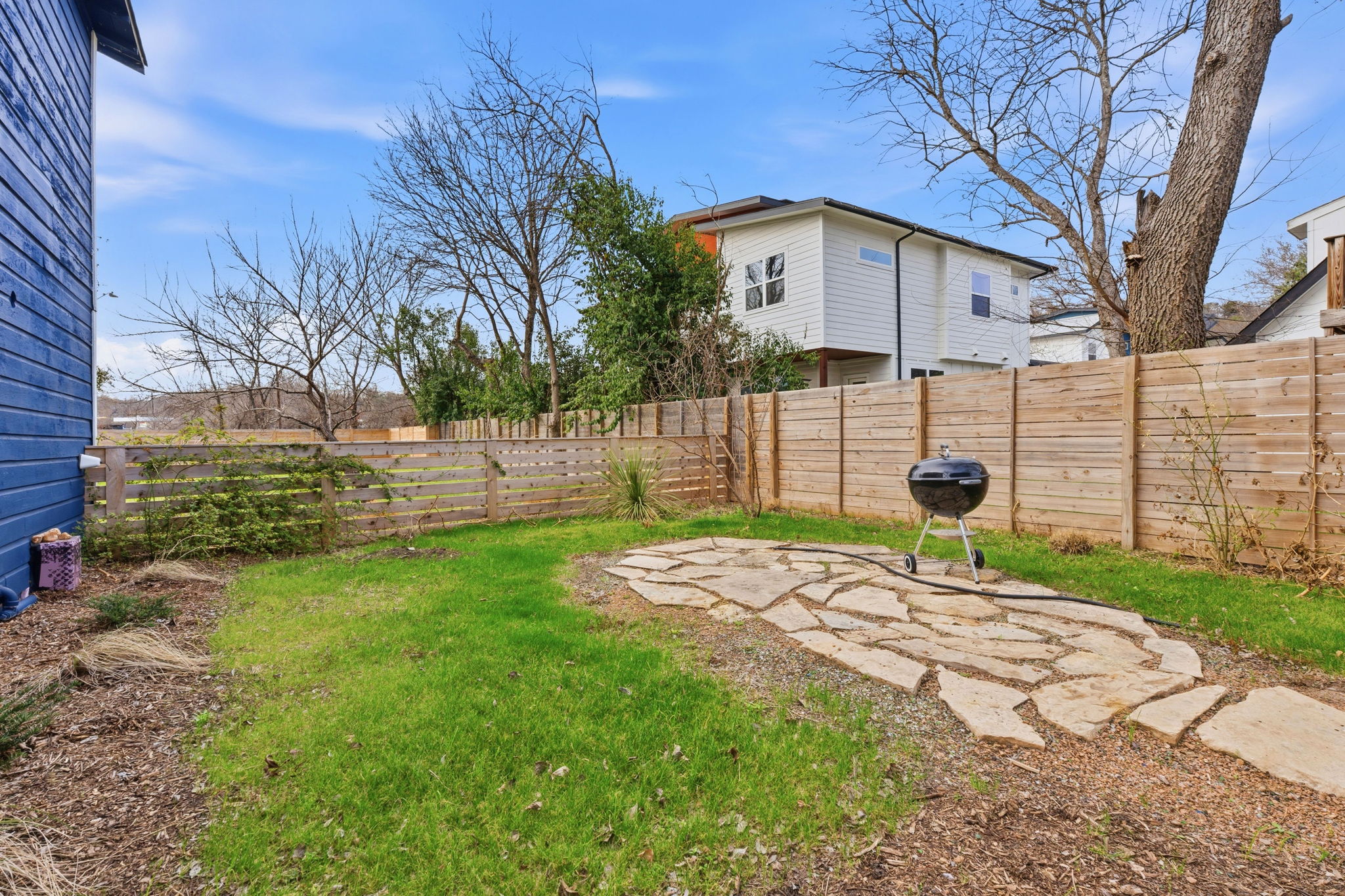 1148 Gunter Street Austin, TX 78721 - Photo 17 of 18 a view of a yard with a house and a large tree