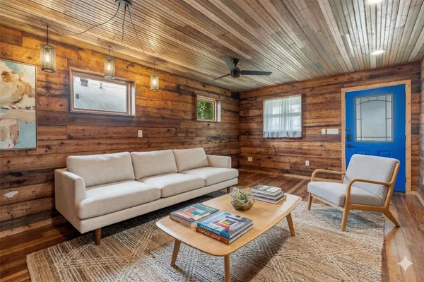 a outdoor living space with furniture and a rug