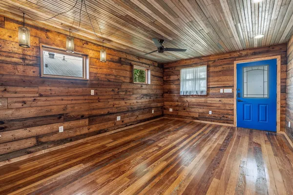 a view of backyard with wooden deck