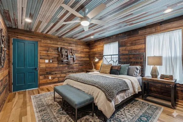 a bed room with a bed and a window