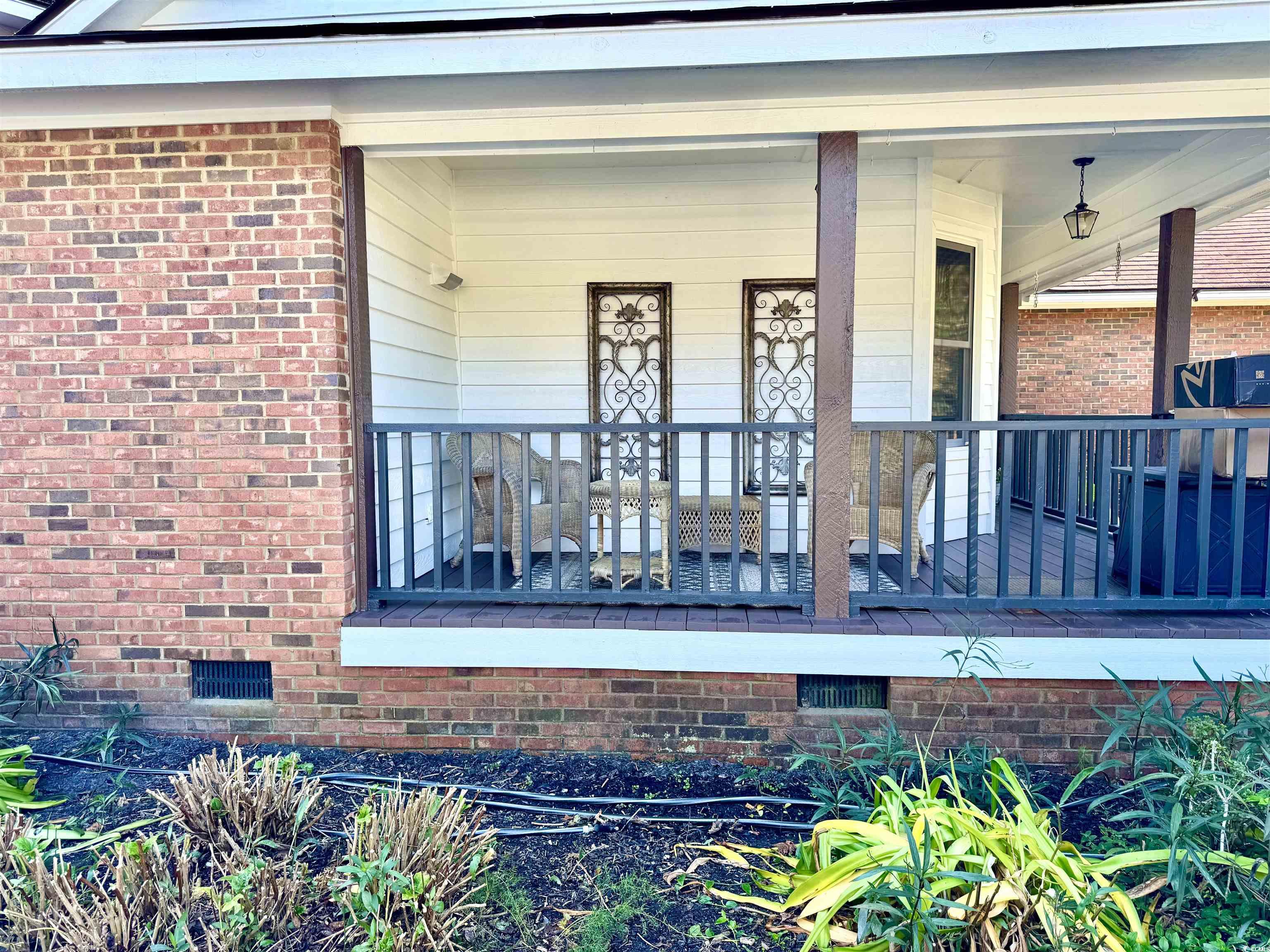 40 Governor Boone Lane Georgetown, SC 29440 - Photo 14 of 33 View of exterior entry with covered porch, crawl space, and brick siding