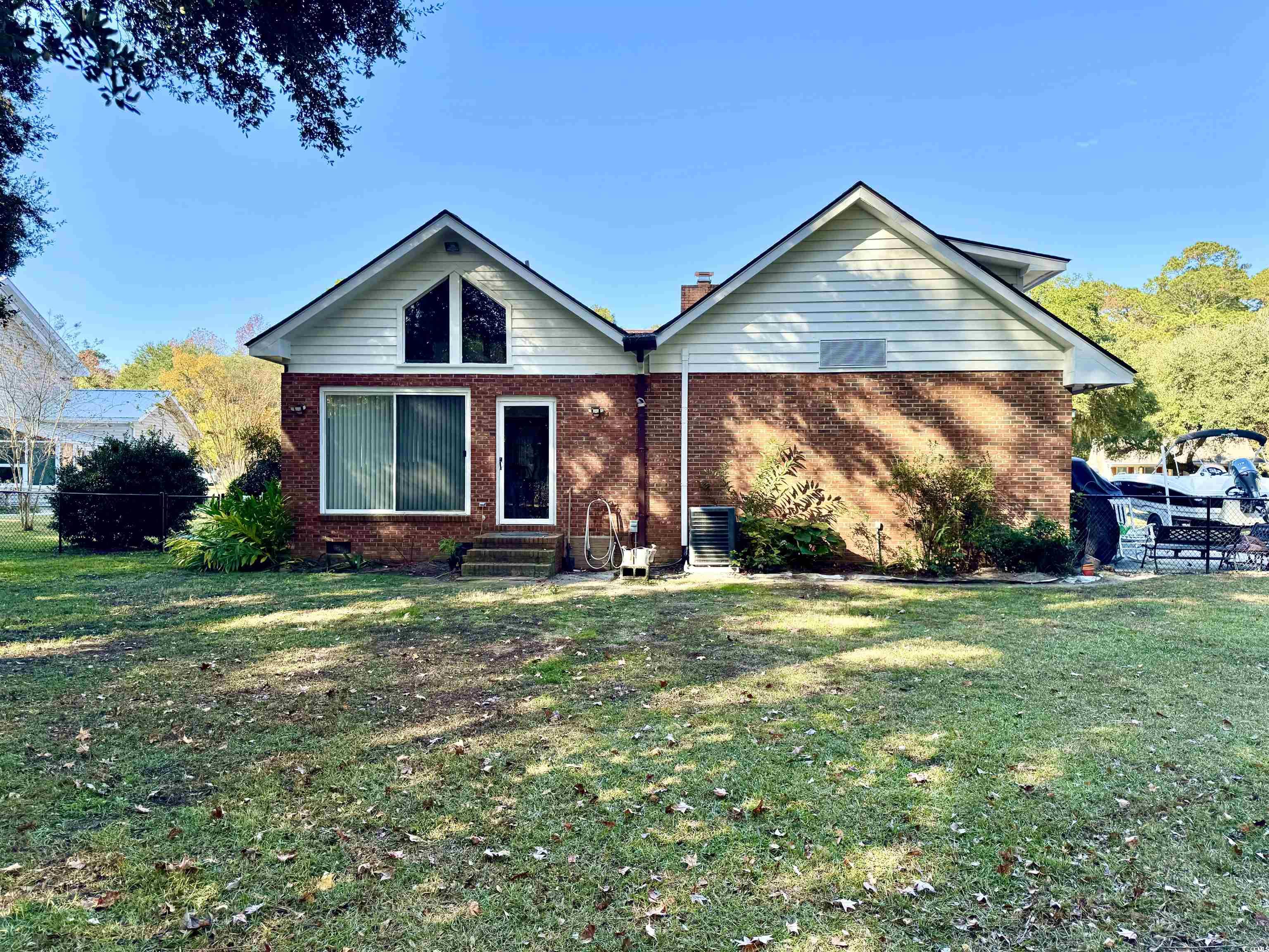 40 Governor Boone Lane Georgetown, SC 29440 - Photo 15 of 33 View of front of property with brick siding, a chimney, crawl space, and entry steps