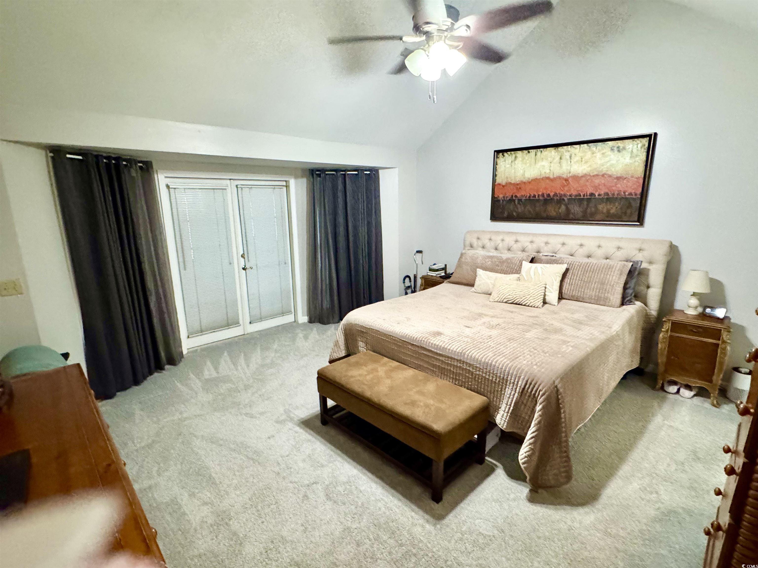 40 Governor Boone Lane Georgetown, SC 29440 - Photo 9 of 33 Bedroom with light colored carpet, vaulted ceiling, and a ceiling fan