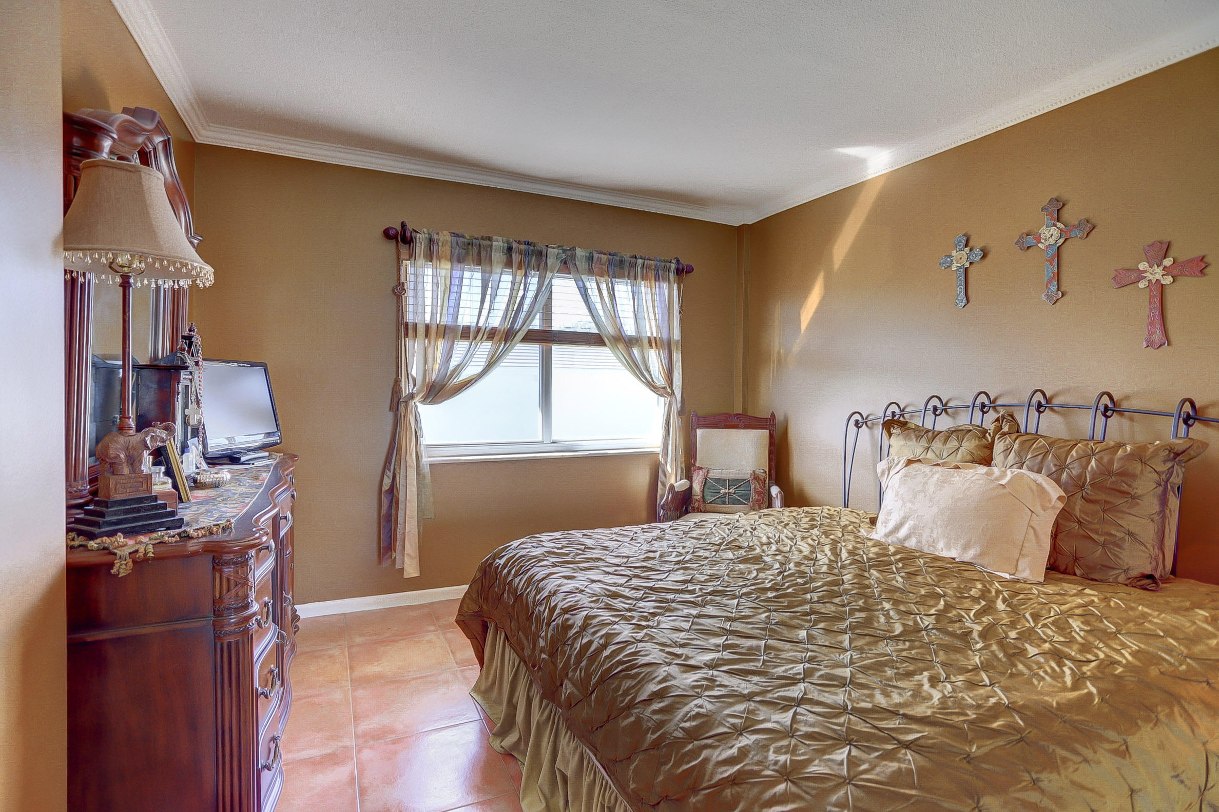 6520 North Ocean Boulevard, Unit 28 Ocean Ridge, FL 33435 - Photo 13 of 32 a bedroom with a bed and wooden floor
