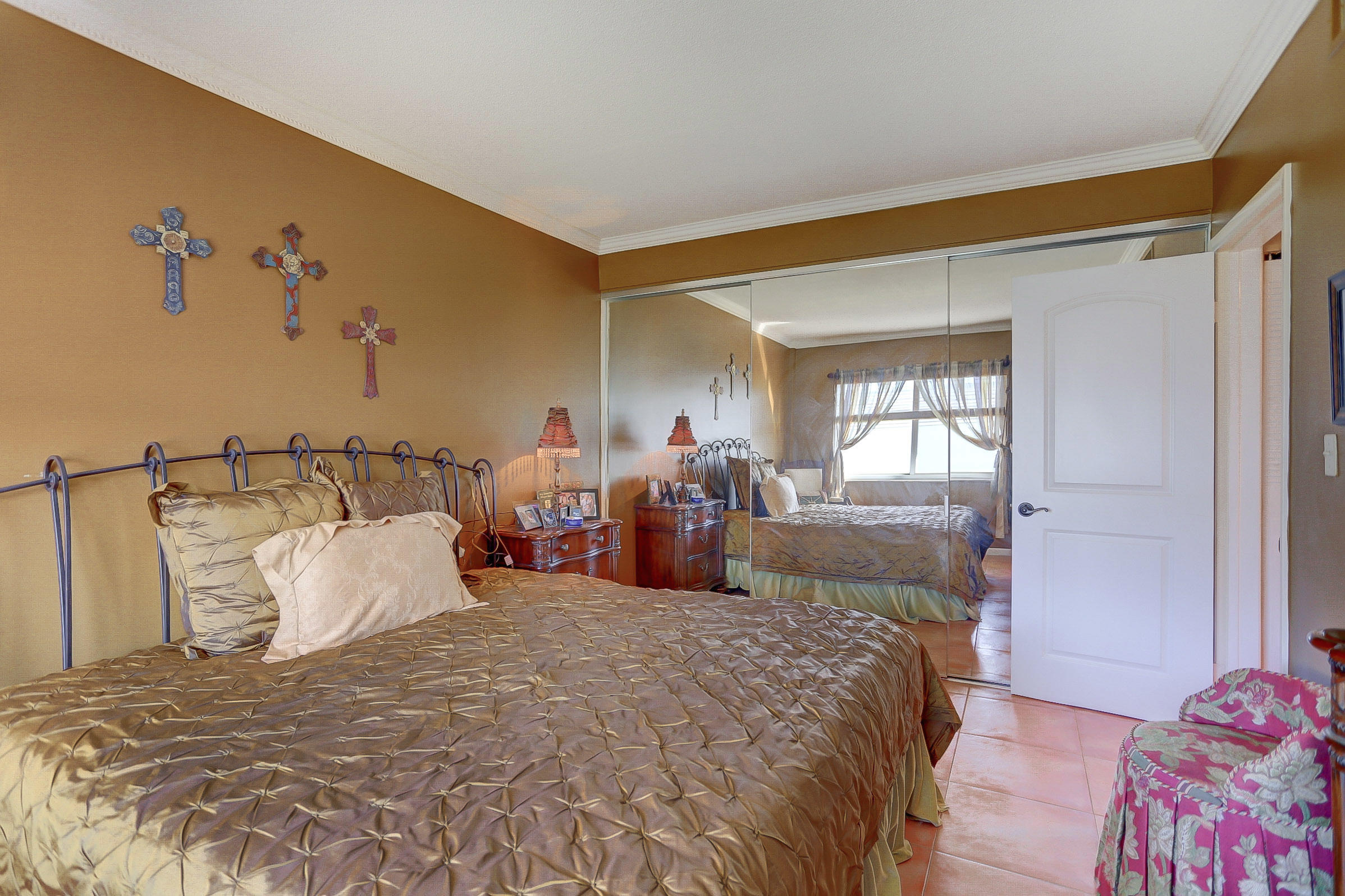 6520 North Ocean Boulevard, Unit 28 Ocean Ridge, FL 33435 - Photo 14 of 32 a bedroom with bed and window